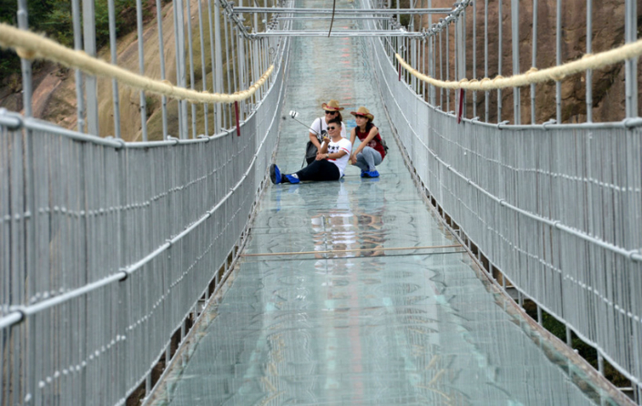 Would you dare to cross this glass suspension bridge