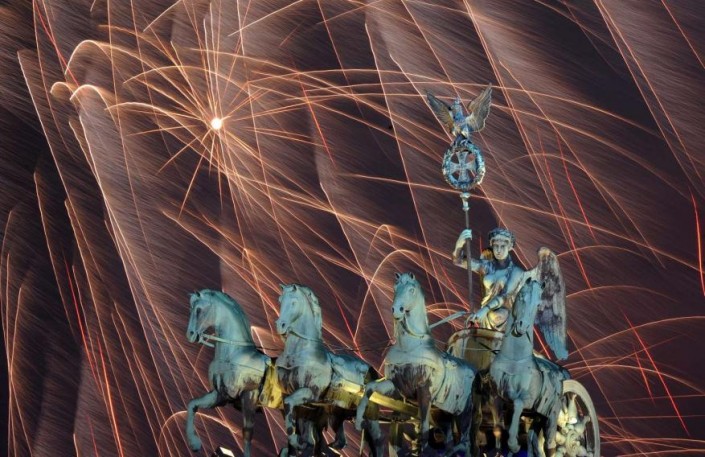 "Celebrating New Year 2014-Berlin_ Germany- Fireworks illuminate the night sky over the Brandenburger Tor"