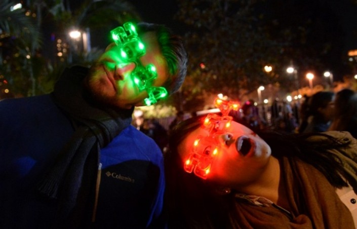 "Celebrating New Year 2014-Partygoers show off their 2014 LED glasses"