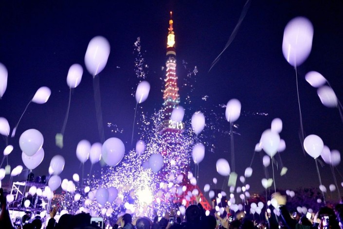 "Celebrating New Year 2014-Tokyo- Japan- People release balloons by the Prince Park Tower"