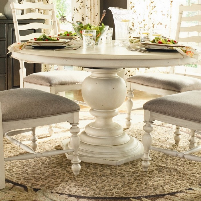 4 white pedestal dining table for classic interiors