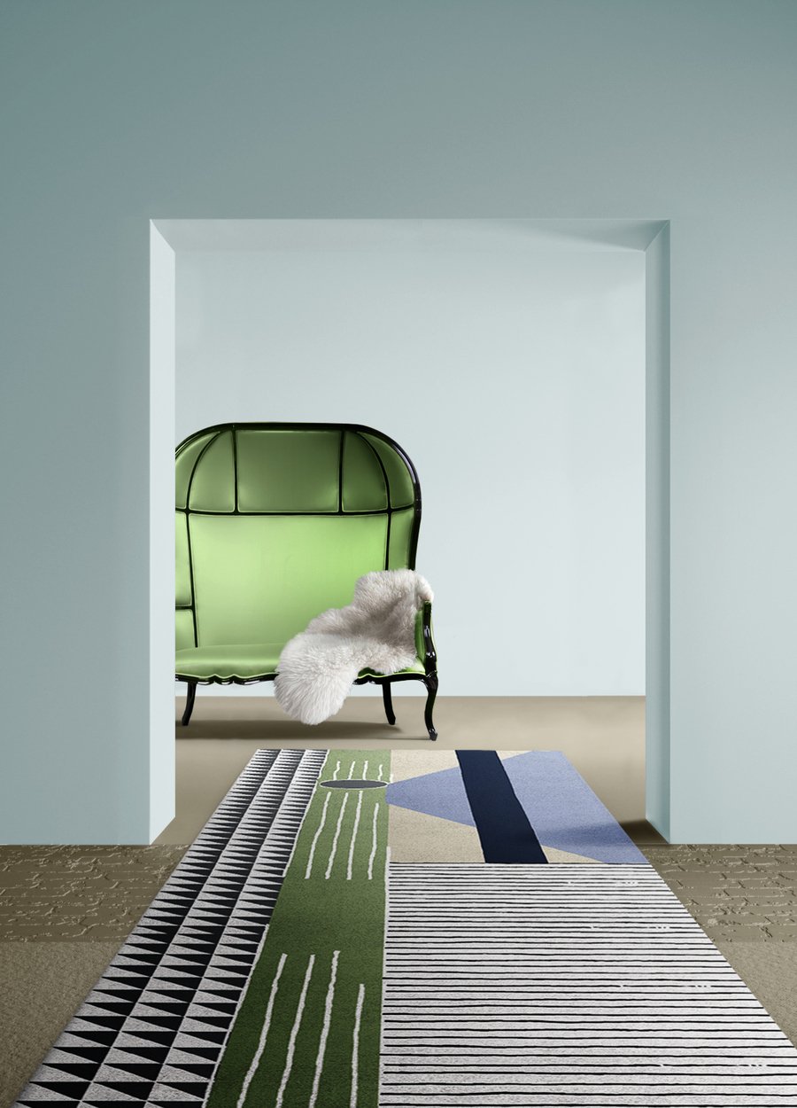 modern hallway featuring big green sofa