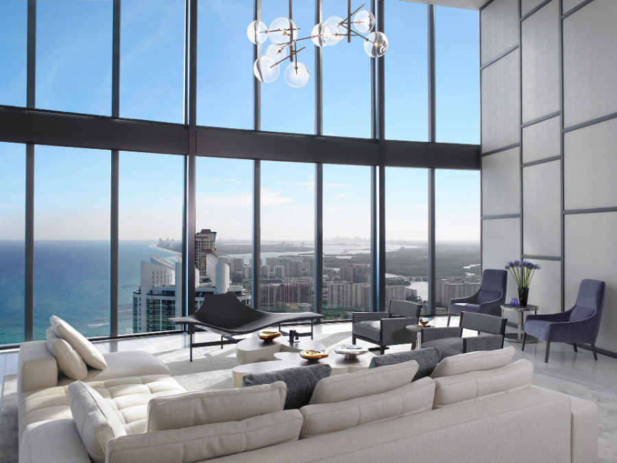 High-end Residential Projects by Michael Wolk - Oceanfront Penthouse. Living room in neutral tones and large windows.