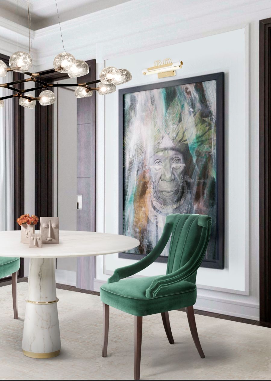 modern dining room design with green velvet upholstered dining chair and round white marble dining table