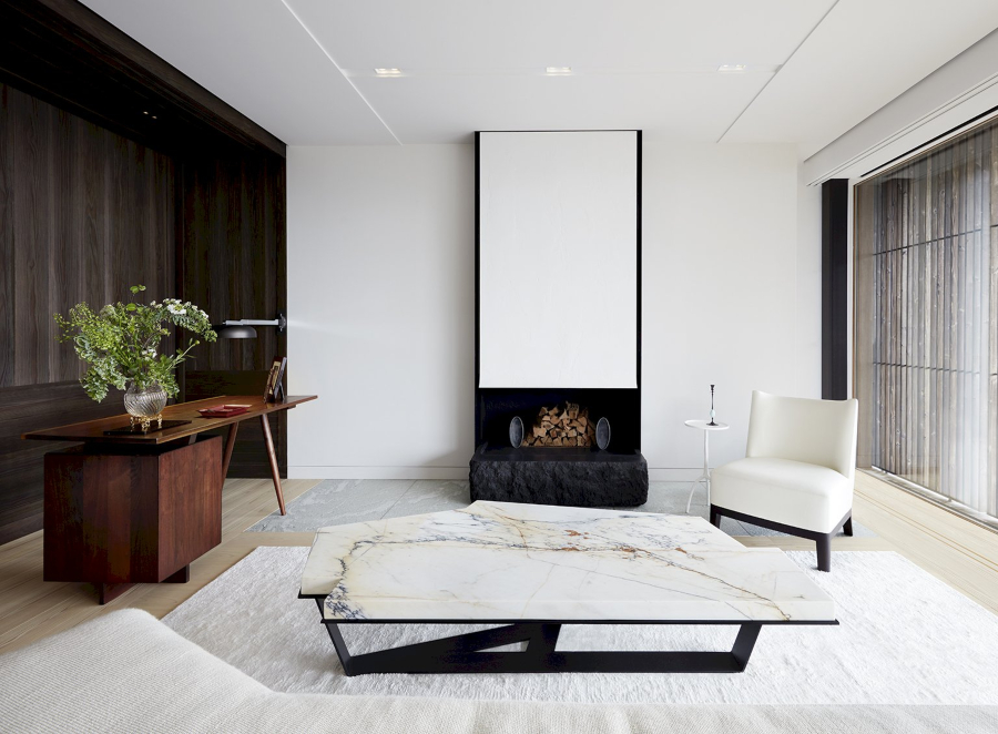 Modern Interior Design Projects by Christian Liaigre. Modern Living Room with neutral tones and white chair.