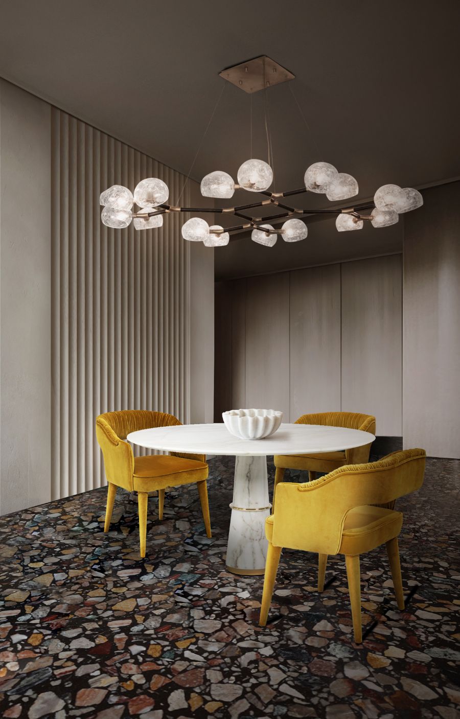 modern dining room with yellow velvet dining chairs and round white marble dining table
