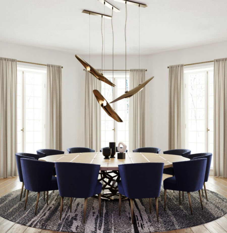 Interior Design Ideas with Yabu Pushelberg. This dining room has the NUKA Dining Chairs providing a comfortable seating solution around the APIS Round Wood Dining Table. The VELLUM Pendant Lights give an elegant finishing touch to this open space modern dining room design.