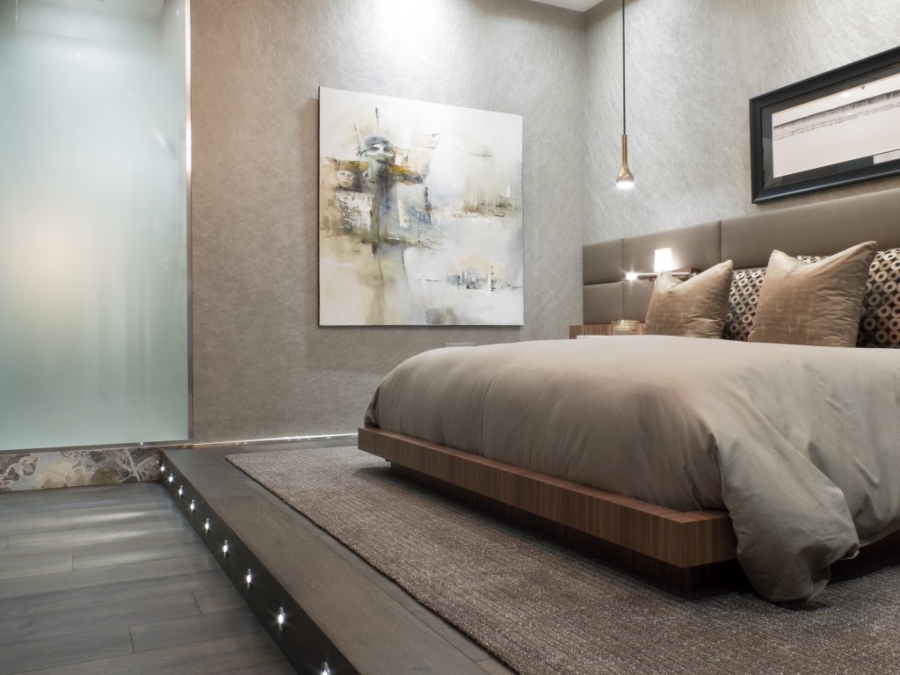 Modern Contemporary Interior Design by Fleur-de-lis Interior Design. This bedroom has brown walls, a brown bedframe and a brown rug.