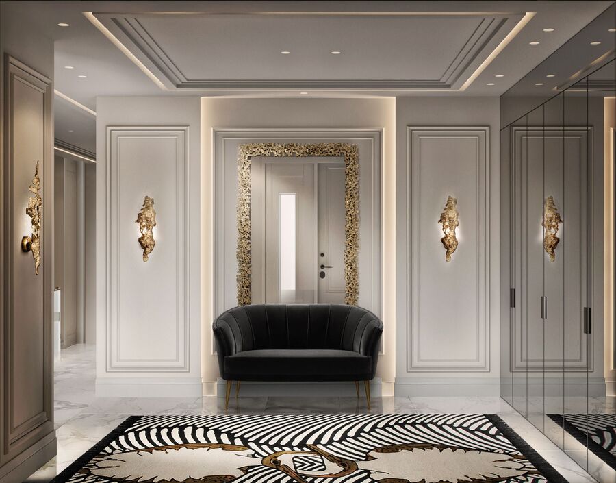 entryway design with golden mirror and golden wall light at iSaloni 22