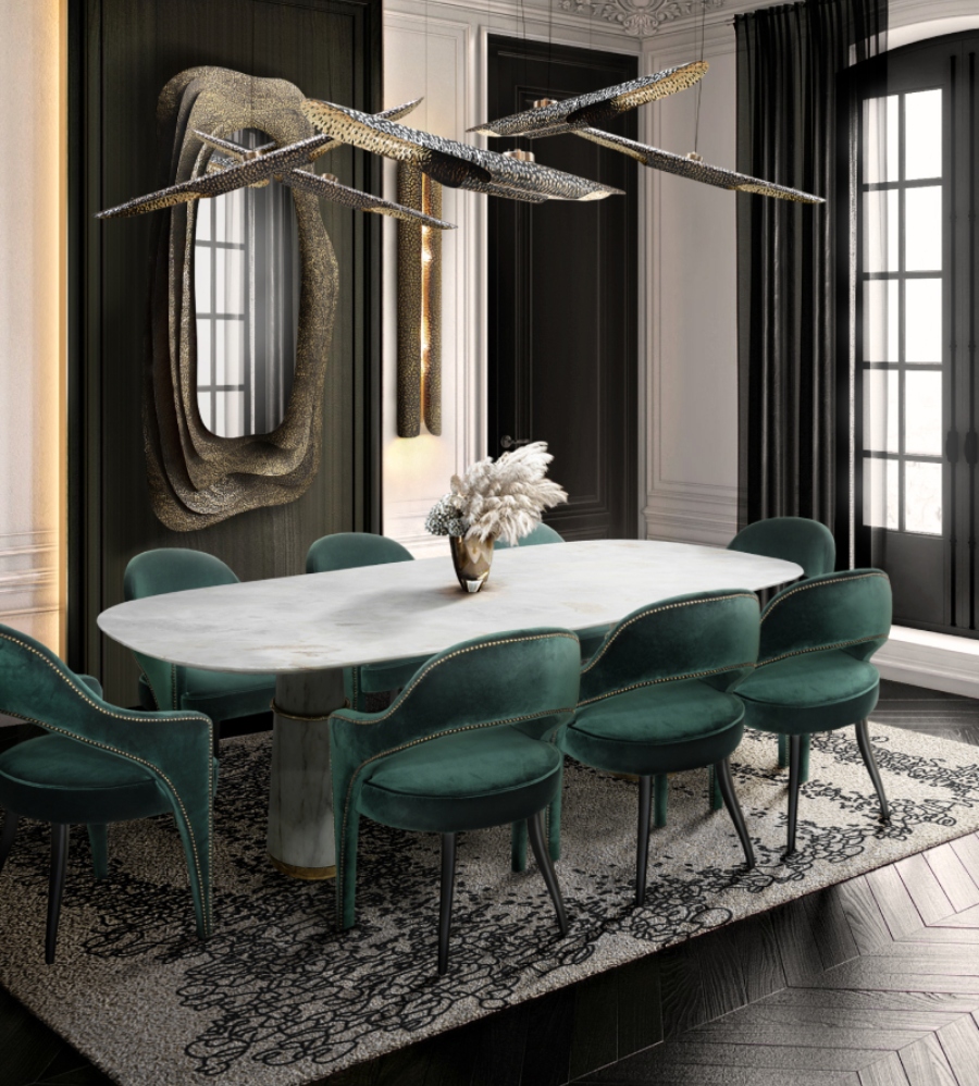 The Best Interior Design Ideas By Audax. The green velvet dining chairs TELLUS surround the white marble dining table AGRA in this modern classic dining room. The KUMI Mirror lends a sense of elegance and sophistication to this modern dining area with traditional colors, while the VELLUM Suspension and Wall Light give a gentle warm glow.