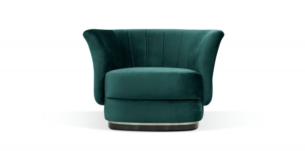 ELK Velvet Armchair with curved back, cotton velvet upholstery, and brass and black lacquer base, adding luxury to a contemporary living room.